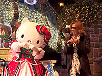 XポーズをするYOSHIKIとハローキティ　(c) 2014 SANRIO CO.,LTD.